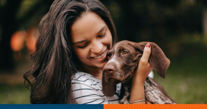 a girl hugging her dog